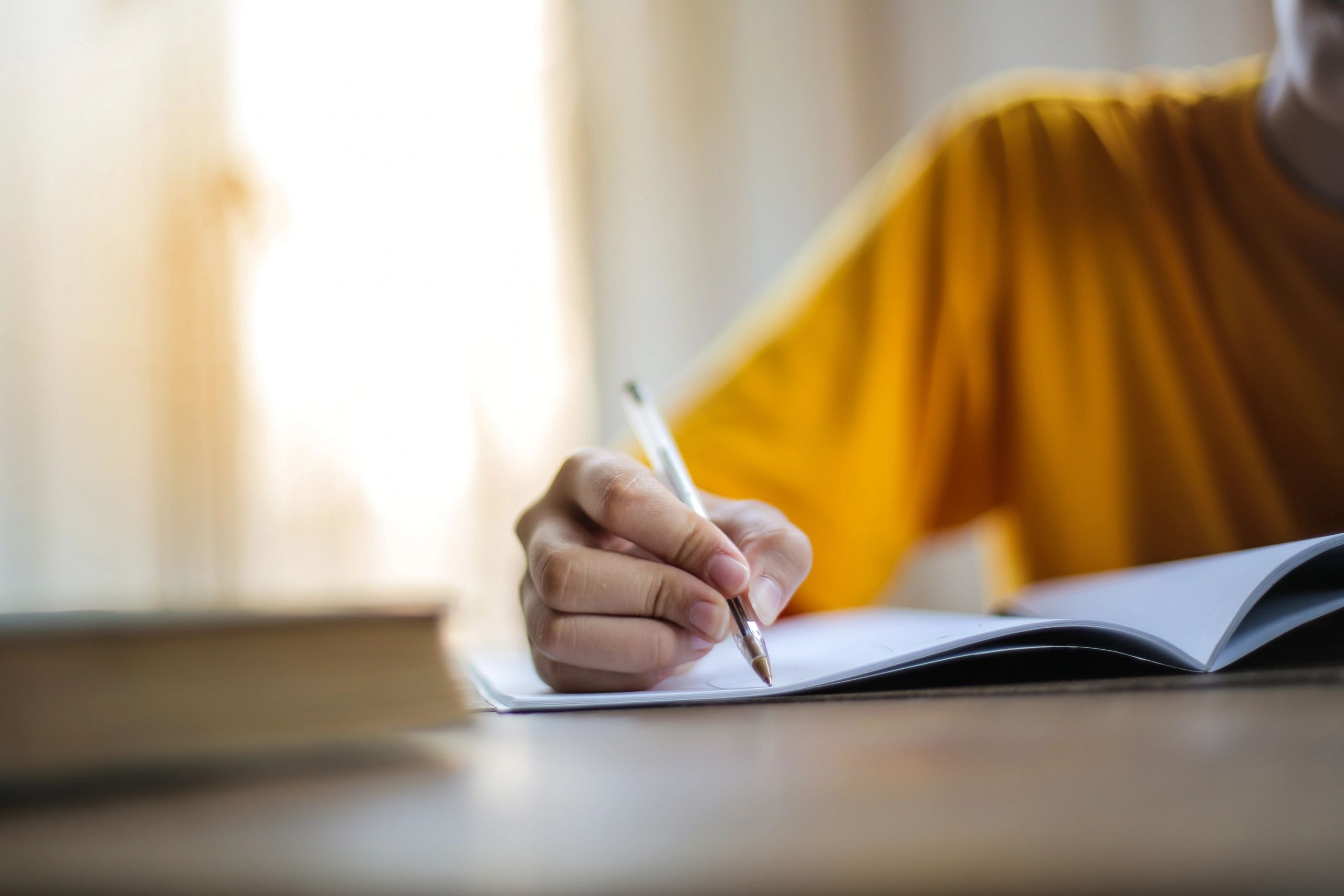Child writing in a notebook